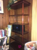 shelf with artificial flowers and bowl