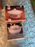 Two covered casserole sets New in B1