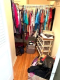 Contents of closet ladies clothes shoe racks Bose purses in B3