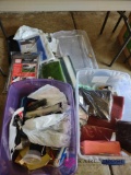 two totes with contents including tarps, blankets, painting supplies, and More