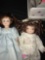 2- porcelain dolls 8 in & 10 in