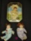 3 seven inch tall porcelain dolls