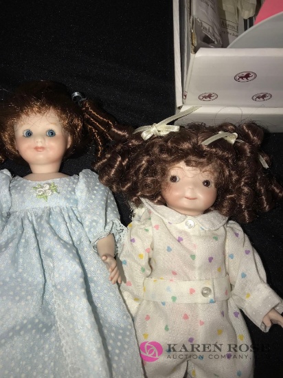 2- porcelain dolls 8 in & 10 in