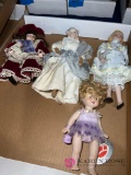 four porcelain dolls