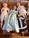 four porcelain dolls 10-12 in tall