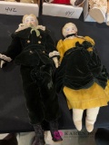 Boy and girl porcelain head dolls