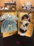 8 inch porcelain doll with trunk and clothing