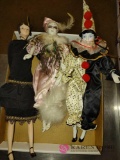 three porcelain 16 inch tall dolls