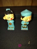 two Japanese bobbleheads