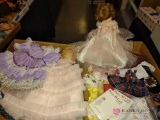 porcelain doll, doll clothes, and accessories