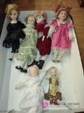 six porcelain dolls 8 to 17 inches tall