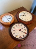 Three wall clocks