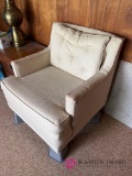 Cream colored chair on wheels