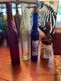four vintage or vintage like wine bottles