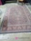 approximately 9 ft by 6 ft oriental rug