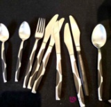 nine pieces of flatware