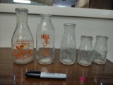 five milk bottles