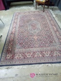 approximately 9 ft by 6 ft oriental rug