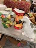 three decorative kitchen water jugs