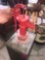 Antique water pump displayed on block of wood