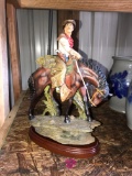 Cowboy riding horse figurine 12 in high