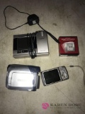 2- Canon digital video camcorder/camera/2- clocks