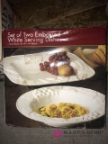 set of two embossed white serving dishes