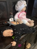 2- collectible vinyl dolls