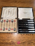 two sets of silverware small knives and spoons