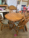 round table and chairs with leaf