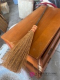 decorative broom with wooden stick handle