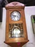 Vintage key wind wall clock with key