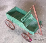 Antique wooden wagon with metal wheels 22 in by 14 in