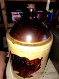 Pottery jug with flag on it 21 inches high