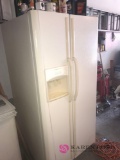 Frigidaire two door refrigerator in garage plug in working bring help to load