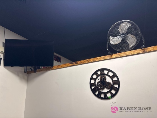 flatscreen TV, clock, fan group