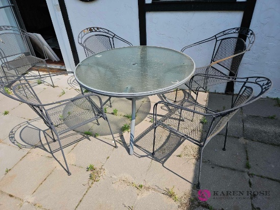 Forty eight inch round patio table with four chairs