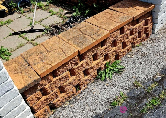 Approximately 98 ft of patio block wall