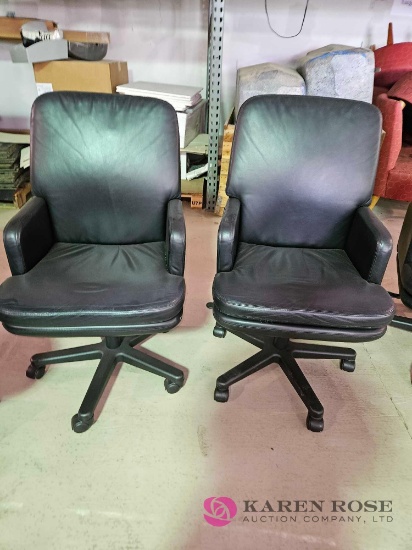 2 rolling office chairs