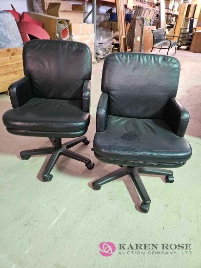 2 rolling office chairs
