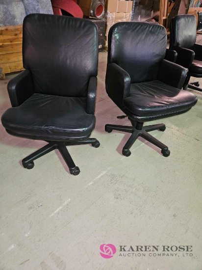 2 rolling office chairs