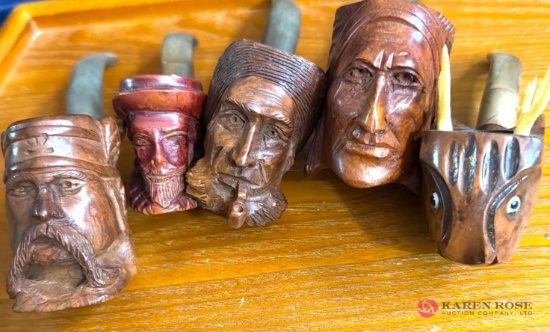 five hand carved pipes