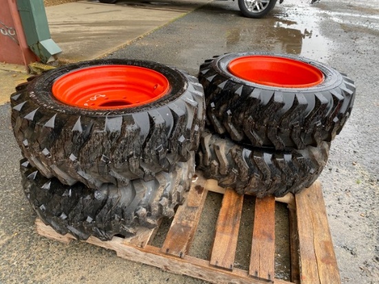 set of 4 NEW skid steer tires & wheels