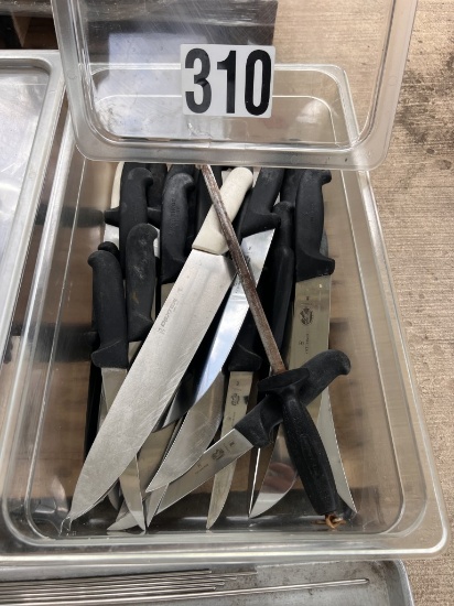 Assortment of kitchen knives and knife sharpener