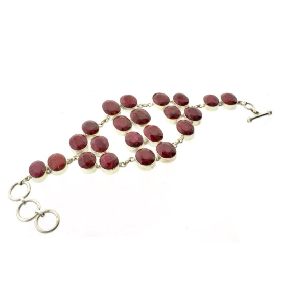 APP: 9k Fine Jewelry, 243.00CT Oval Cut Ruby And Sterling Silver Bracelet with a Toggle Clasp