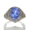 APP: 17.8k 14 kt. White Gold, 6.07CT Oval Cut Tanzanite And 0.60CT Round Cut Diamond Ring