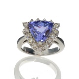 APP: 15.1k 14 kt. White Gold, 4.35CT Trillion Cut Tanzanite And 0.52CT Round Cut Diamond Ring