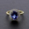 Auction Opportunity! Breathtaking Yellow Gold Ring with Center 1.41 Carat Oval Tanzanite and Nice Di