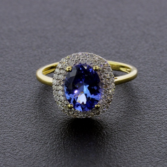 Auction Opportunity! Breathtaking Yellow Gold Ring with Center 1.41 Carat Oval Tanzanite and Nice Di