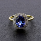 Auction Opportunity! Breathtaking Yellow Gold Ring with Center 1.41 Carat Oval Tanzanite and Nice Di
